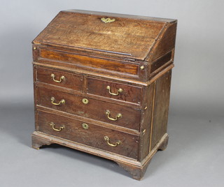A 17th/18th Century oak bureau with fall front revealing a fitted interior, above 2 short and 2 long drawers with brass swan neck drop handles 96cm h x 82cm w x 51cm d 