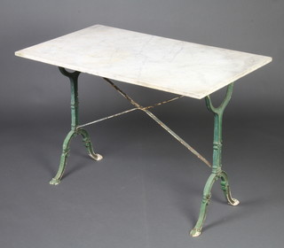 A Victorian white marble and wrought iron rectangular garden table raised on outswept supports 70cm h x 100cm w x 60cm d 