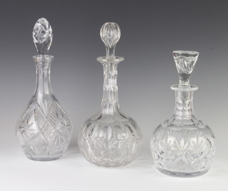 An Edwardian mallet shaped decanter and stopper 30cm, 2 others