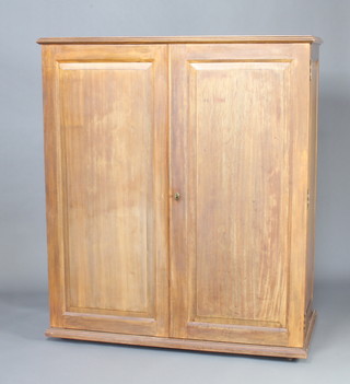 A 1920's "Ingenuity Ingenaites Ltd" compactum style walnut wardrobe - the interior fitted a hanging rail, recess with hat bracket, 3 shallow drawers and 7 trays enclosed by a pair of panelled doors 152cm h x 131cm w x 63cm d  