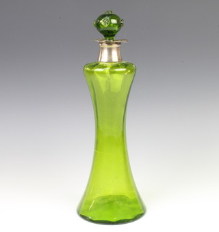 A Victorian green glass waisted decanter with silver collar 34cm, London 1897 
