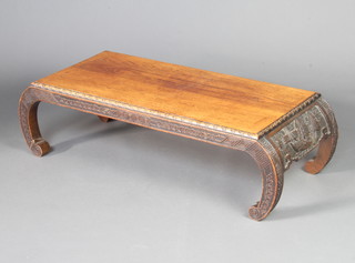 A 1920's carved oak Chinese opium coffee table with carved apron 32cm h x 112cm w x 49cm d 