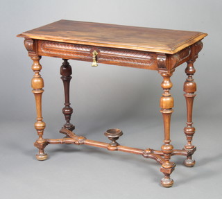 A 19th Century rectangular Continental walnut side table fitted a drawer, raised on cup and cover supports with Y framed stretcher 72cm x 90cm x 43cm 