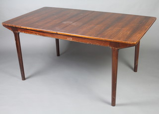 A H Mcintosh & Company Ltd, a 1970's rosewood extending dining table raised on turned supports with 2 concealed extra leaves 74cm h x 91cm w x 62cm l x 237 cm when extended, the underside of the frame is marked April 1972 and 1 leaf marked patent no. 1012786 Cites certificate reference
