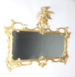 A Chippendale style plate wall mirror contained in a gilt hardwood frame surmounted by a figure of an eagle 97cm h x 133cm 
