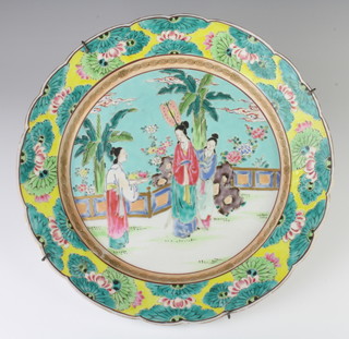 A Chinese famille rose plate decorated with 3 ladies on a terrace 34cm 