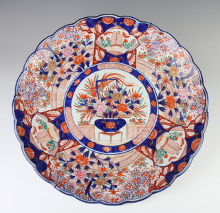 An Imari platter decorated with a central panel of flowers surrounded by panels of insects, birds and flowers 40cm 