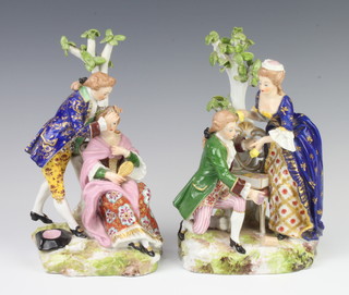 A pair of 19th Century Derby style figure groups of a lady and gentleman seated beneath a tree 22cm 