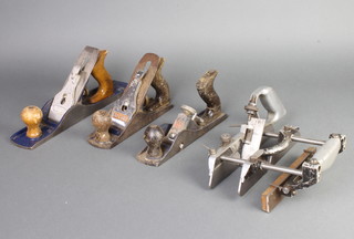 A Record no.04 smoothing plane, a Spinney no.5 smoothing plane, a PM no.10 smoothing plane and a Lewin rebate plane 