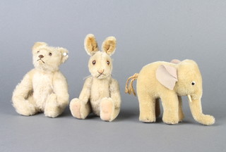 A Steiff figure of a white teddy bear with stud to ear 15cm, ditto elephant 4cm marked G310,0  and a similar rabbit (no stud to ear) 16cm 