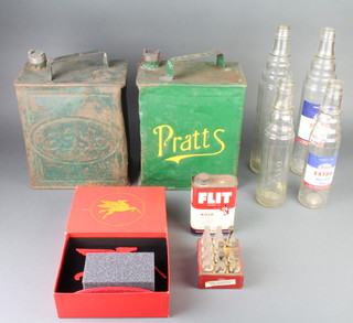 A Pratt's green painted pressed metal petrol can (some dents and rust), an Esso ditto, four glass Esso Motor Oil bottles, a Vacuum Oil Company and Exon Mobile Company 130th anniversary pressed metal table model, an Esso flint tin and a miniature crate of Coca Cola bottles (1 missing)  

