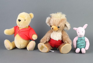 A Deans limited edition Pooh Bear no.483 31cm complete with bag, ditto Piglet no.0146 19cm and a Merrythought bear 30cm 