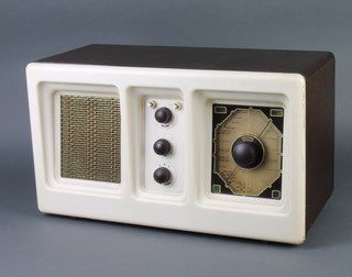 A Radio Rentals model RR57 radio contained in a brown and white Bakelite case 