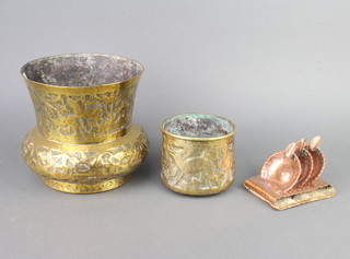 An Eastern embossed brass vase of thistle form 17cm x 18cm, an Eastern brass jardiniere 9cm x 10cm, 3 circular Eastern copper ashtrays and stand