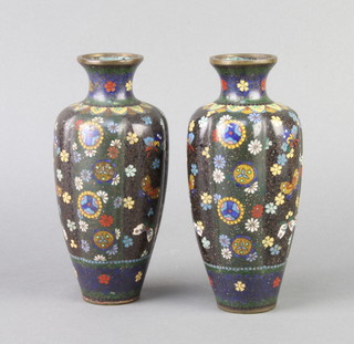 A pair of 19th Century Japanese black and floral patterned vases with ribbed decoration 18cm x 5cm  