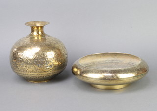 An Eastern embossed melon shaped vase decorated panels 20cm x 10cm together with an Indian circular brass bowl 6cm x 26cm 