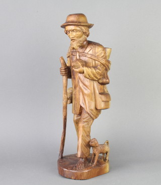 A Canadian carved hardwood figure of a standing maize harvester 47cm x 13cm x 14cm 