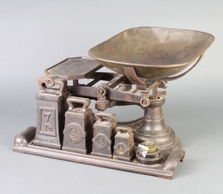 A set of costermongers iron scales complete with weights 