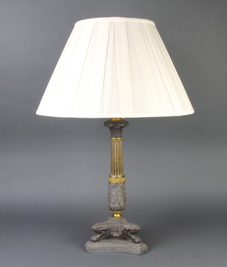 A Regency style gilt metal table lamp raised on 4 paw supports with triform base 40cm x 19cm 
