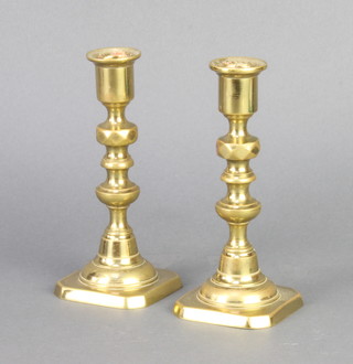 A pair of 19th Century brass candlesticks with knopped stems 15cm x 6.5cm x 6.5cm 