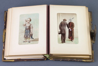 A Victorian leather bound musical photograph album containing humorous prints