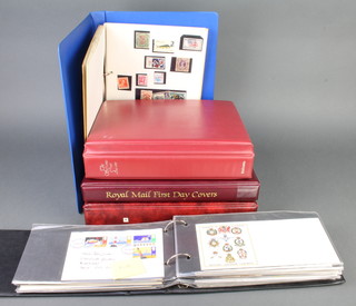 Three albums of GB Elizabeth II first day covers, an album of PHQ cards 