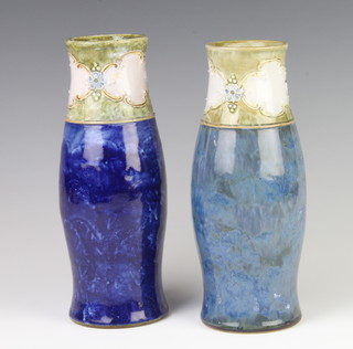 A near pair of Royal Doulton baluster vases 24cm and 23cm 