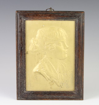 A gilt decorated ceramic plaque of a young lady bearing a monogram 18cm x 12cm 