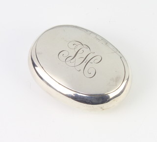 An Edwardian oval silver snuff box with patent lid, engraved monogram, Birmingham 1904 6.5cm, 50 grams