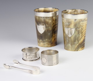 A silver napkin ring Birmingham 1926, 1 other, a pair of tongs 63 grams and a pair of plated mounted horn beakers with cut glass bottoms  