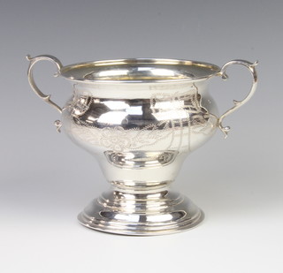 A silver two handled baluster cup decorated with flowers 11cm, London 1922, 200 grams