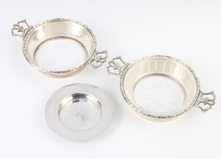 A pair of silver dish holders London 1915 Goldsmiths and Silversmiths Co and a circular nut dish 190 grams