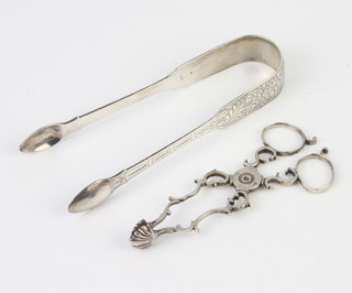 A pair of Georgian silver scissor action sugar tongs and a pair of plain tongs 88 grams