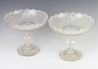 A pair of Edwardian cut glass comports with baluster stems 20cm 