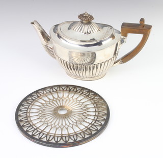 A Victorian demi-fluted silver teapot with fruitwood mounts, gross 302 grams, together with a silver mounted kettle stand 