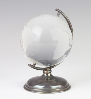 An engraved glass globe 7cm on a silver stand 10cm 