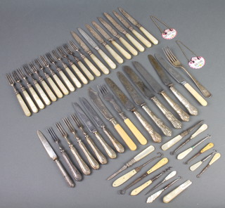 Twelve silver and mother of pearl dessert forks and 8 matching knives and other minor cutlery 