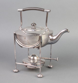 An Art Nouveau silver plated tea kettle on stand with burner, raised on ball feet