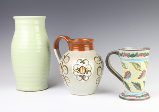 A Denby Studio jug 18cm, a ditto jug 14cm and a ribbed vase 