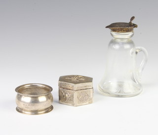 A silver mounted bottle Birmingham 1912 10cm, a napkin ring and a hexagonal box 