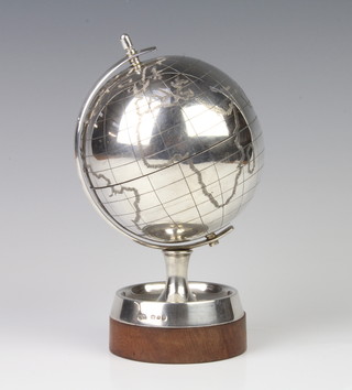 A silver globe on a turned wood stand, London 1969, 17cm, maker Mappin & Webb, gross weight 390g