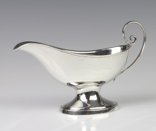 A Sterling silver sauce boat with scroll handle 150 grams