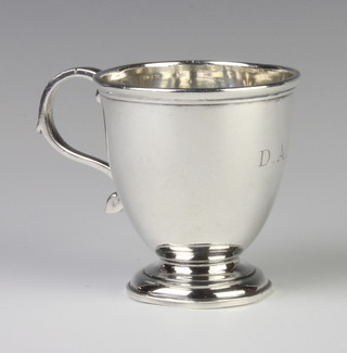 A silver baluster mug with S scroll handle and engraved monogram, London 1945, 100 grams 