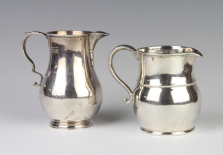 A Georgian style silver baluster cream jug London 1902, a baluster ditto London 1929, 247 grams