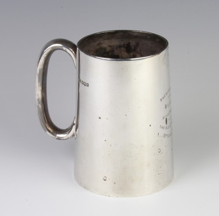 A silver Art Deco mug with simple handle and engraved inscription, Sheffield 1931, 13cm, 364 grams