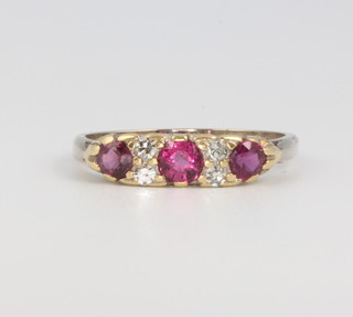 An 18ct yellow gold ruby and diamond ring size P, 3.6 grams 