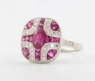 An Art Deco style platinum, ruby and diamond dress ring size N 