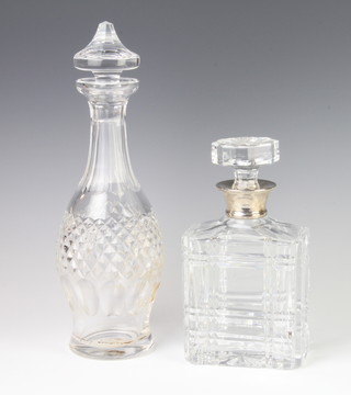 A rectangular cut glass spirit decanter with silver collar 22cm, a mallet shaped ditto 30cm 