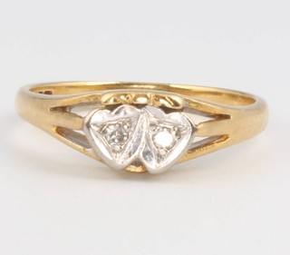 An 18ct yellow gold double heart shaped diamond ring, size L 1/2, 3.5 grams