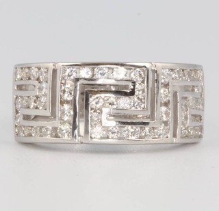 An 18ct white gold diamond set Greek key pattern ring, size P 1/2, 5.6 grams 